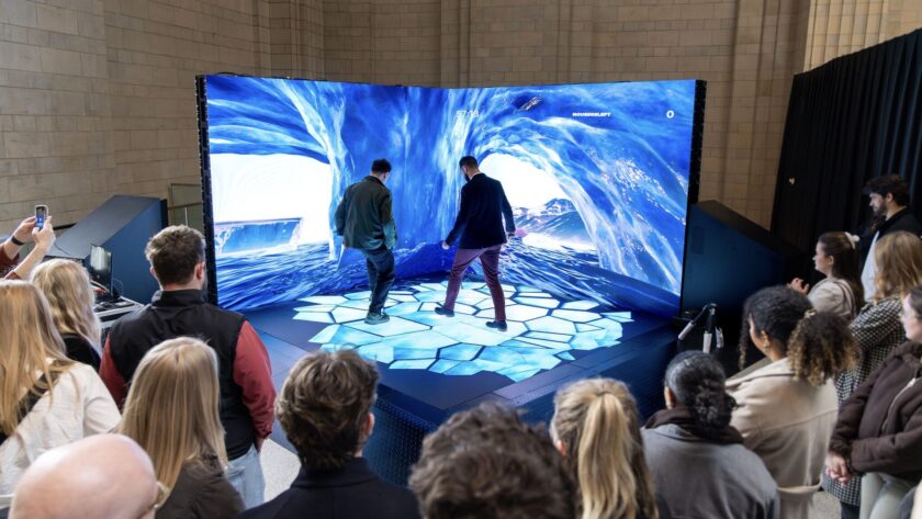 Visitors interact with Ocean Outdoor’s Portal at Battersea Power Station (Image: Ocean Outdoor)