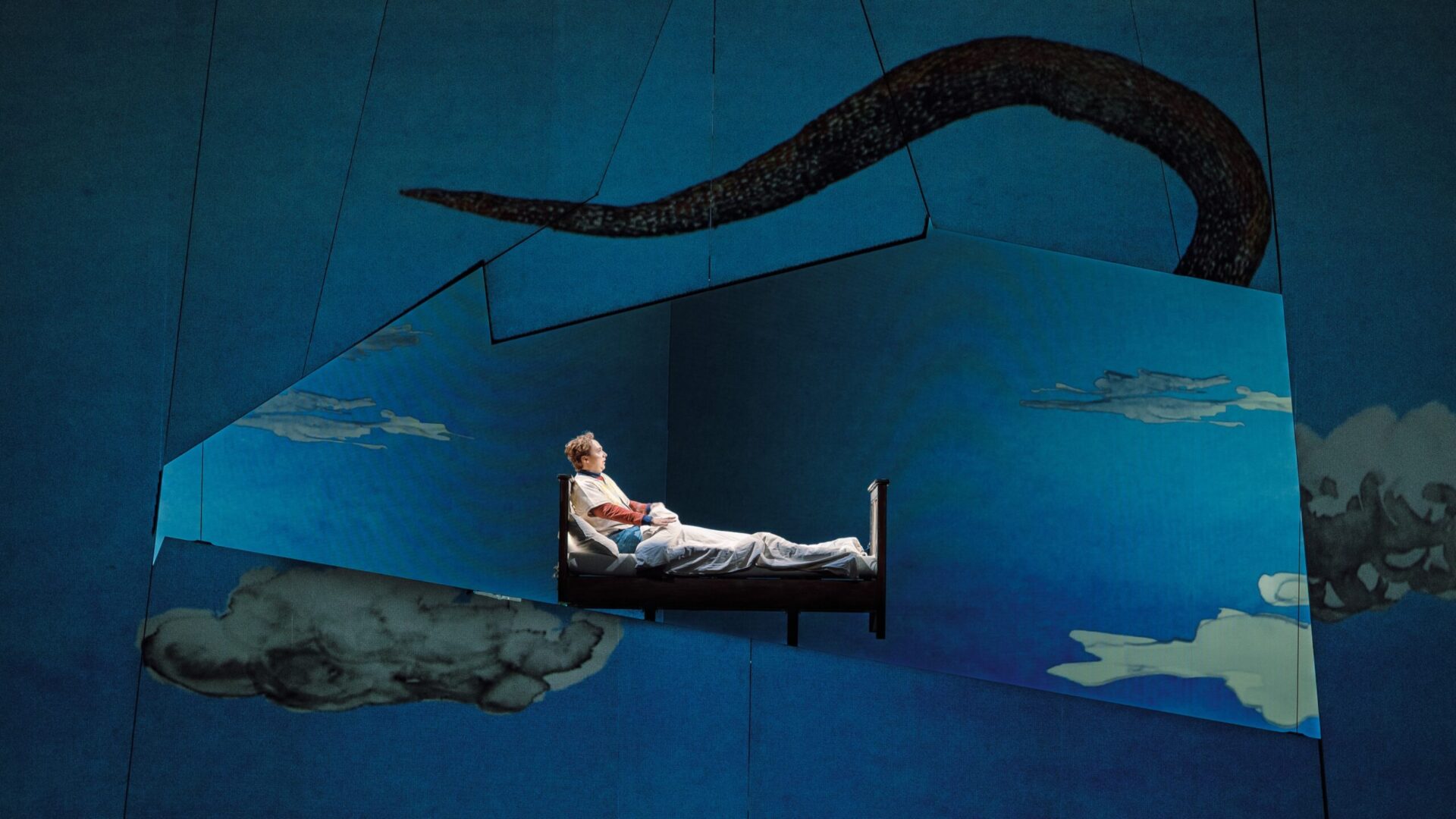 Projection mapping transforms moving stage elements into immersive digital scenery during Volksoper Wien's production of The Magic Flute, with Stage Precision software synchronizing visuals in real time. (Image: Volksoper/Marco Sommer)