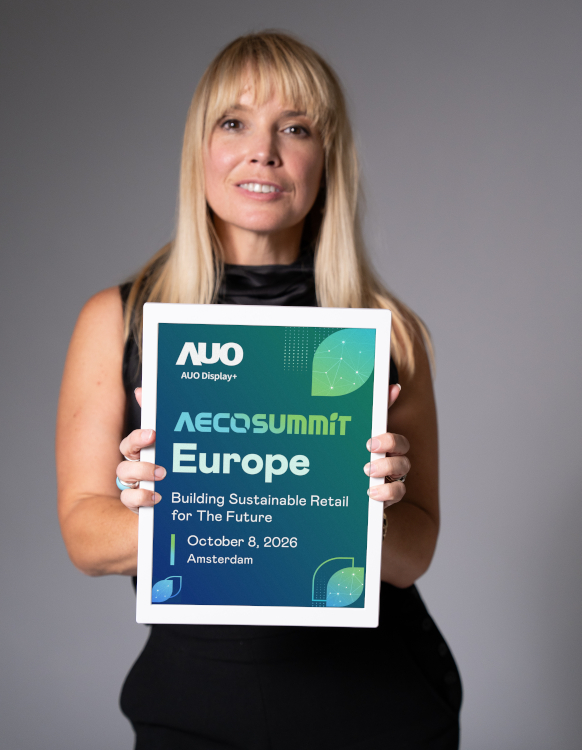 Sian Rees, AUO Display Plus, with the 13.3" AecoPost colour ePaper display, shown with AecoSummit Europe 2026 content. (Image: AUO Display Plus)