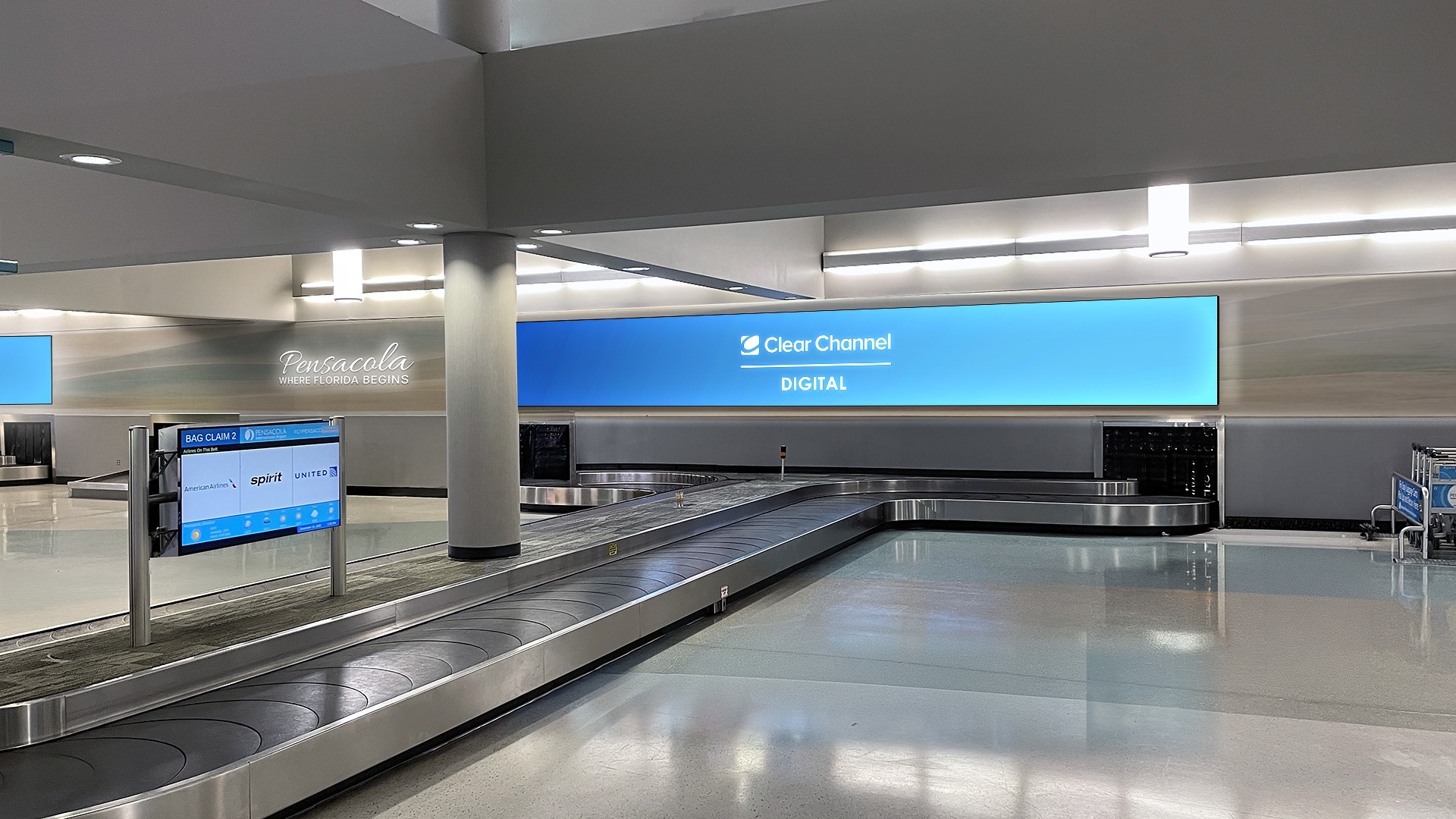 A digital advertising display overlooks the baggage claim area at Pensacola International Airport. (Image: Clear Channel Outdoor)