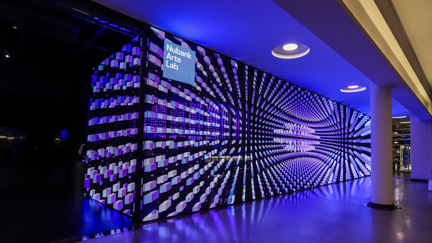 An 84-square-meter (904-square-foot) transparent LED facade welcomes visitors to Nubank Arte Lab, combining digital imagery with 75% transparency (Image: ON)