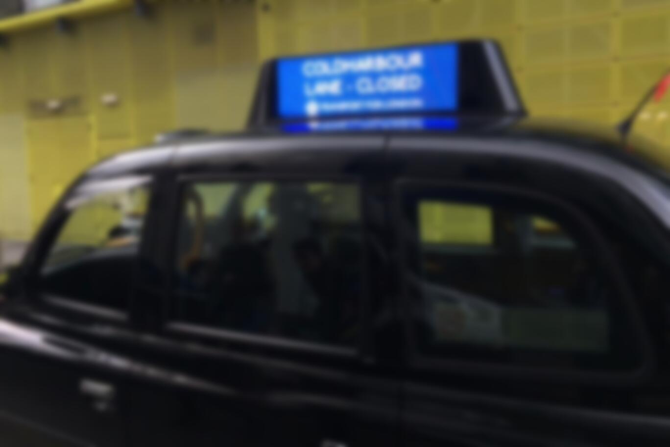 Signs On London Black Cabs Enlisted To Warn Motorists Of Clogged Roads