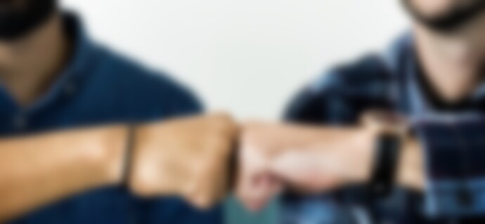 10net, Unified Brand Forge Digital Signage Solutions Partnership - Closeup of men fist bumping