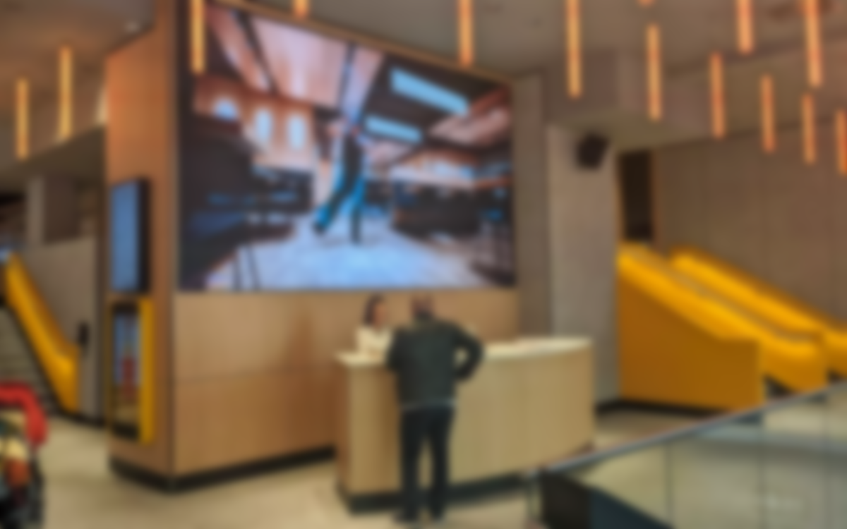 Vast Vienna McDonald’s Flagship “Breaks The QSR Cliche” With LED Video Walls, Hotel Lobby Feel