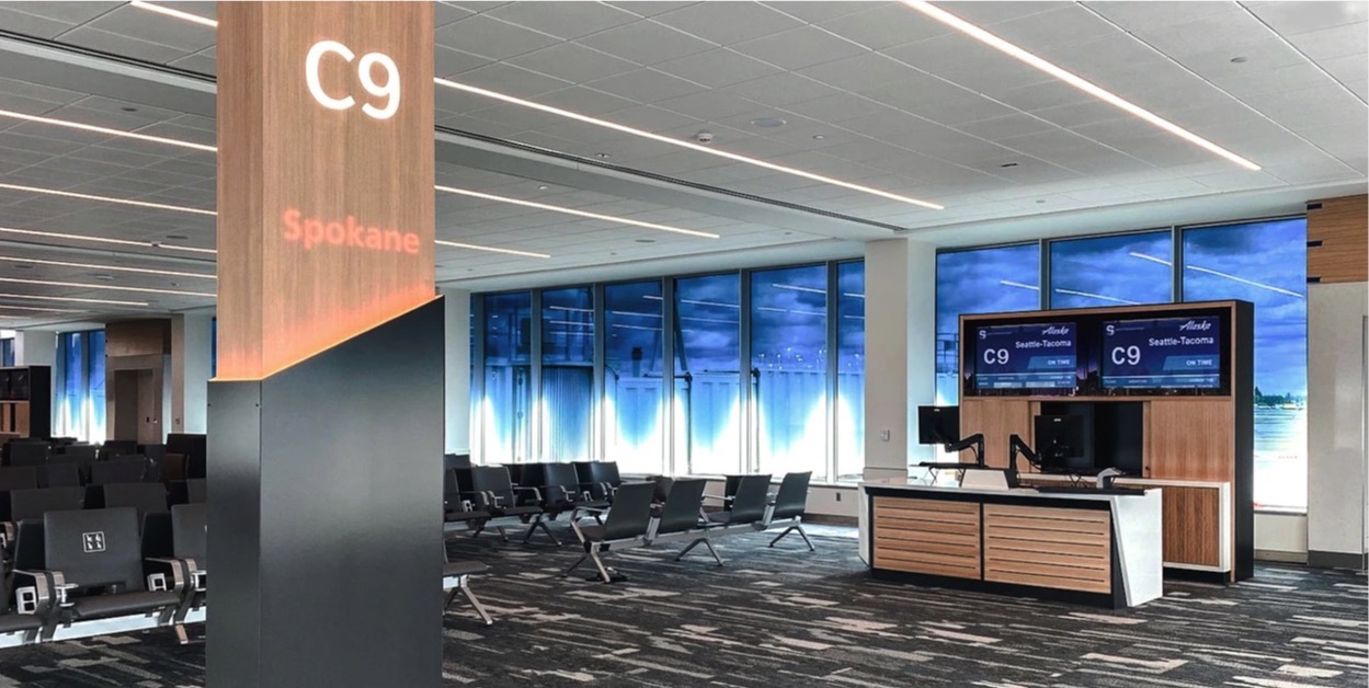 Gate Information Appears Through Wood Totems Airside At Spokane’s Expanded Airport -