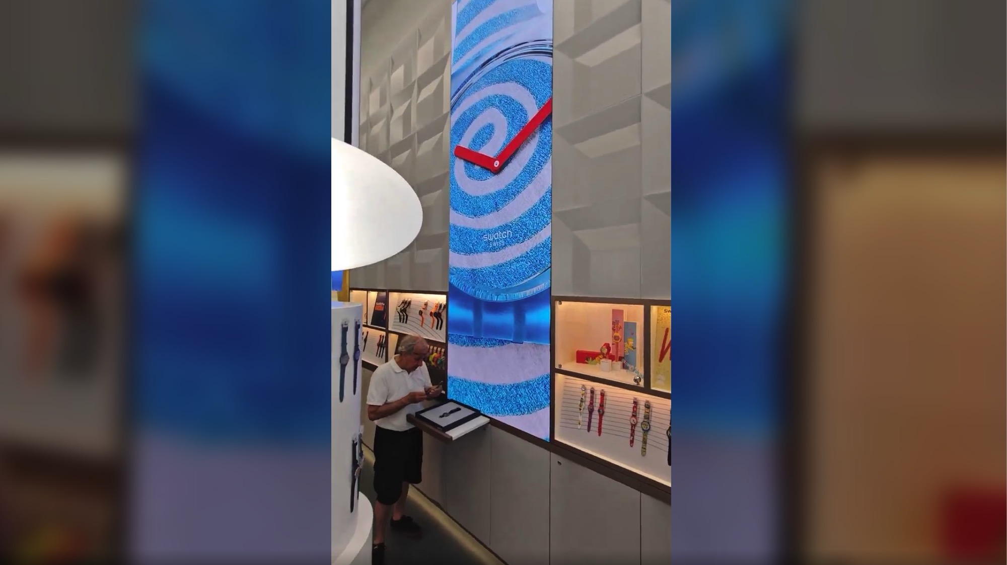 Swatch Store In Milan Uses Series of Wall-Embedded LED Columns To Drive Experience