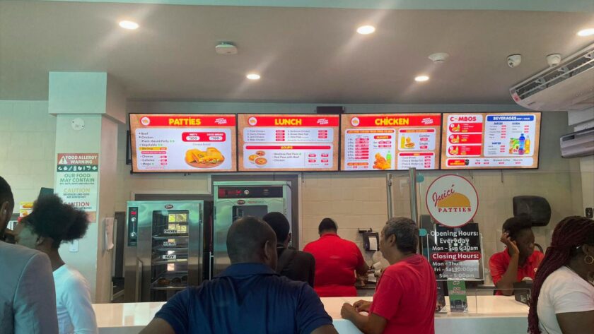 Digital menu boards deliver consistency and speed inside a Juici Patties location