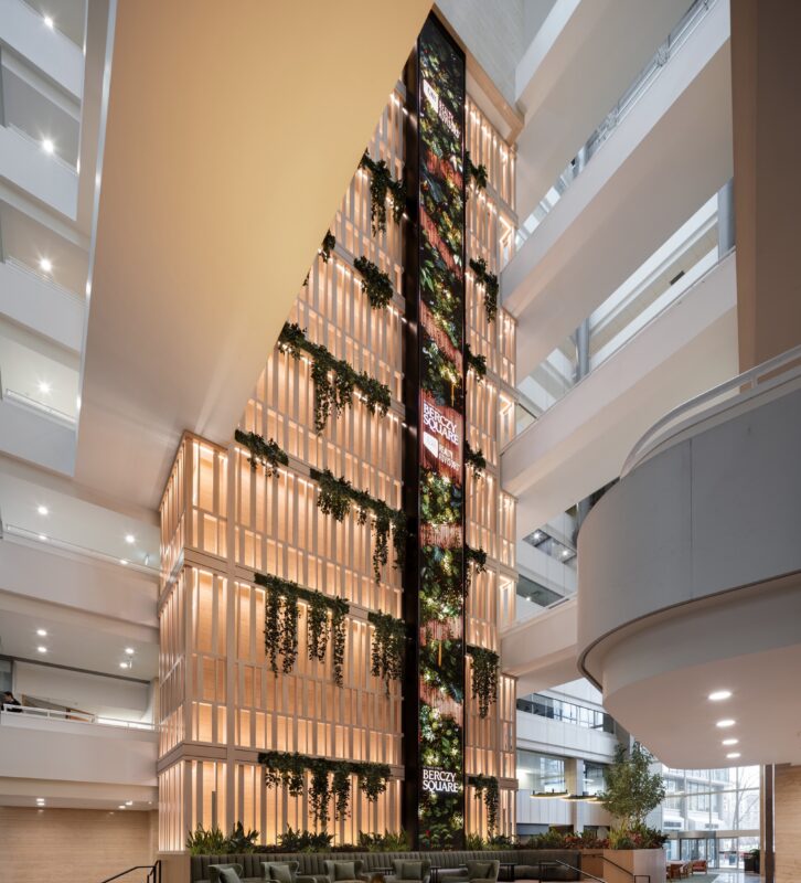 A 90-foot (27.4-meter) vertical LED art screen runs through the atrium lobby at Berczy Square in downtown Toronto. (Image: GWL Realty Advisors)